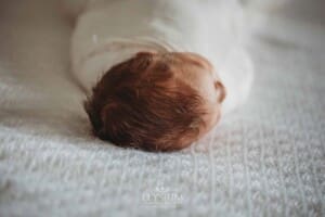 A photograph showing a baby girls soft hair on her head