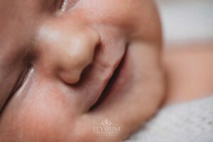 Newborn Photography: close up of a baby's smiley mouth