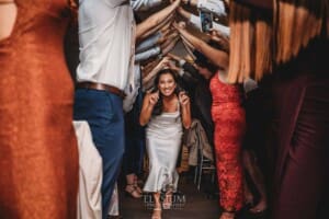 Sydney Wedding - bride running through a farewell arch after the reception at Springfield House