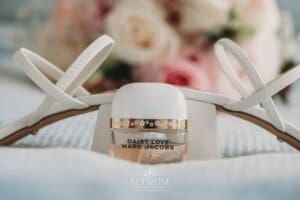 Sydney Wedding - a brides perfume sits against her shoes and bouquet