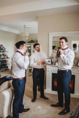 Sydney Wedding - groomsmen and the groom put on their ties