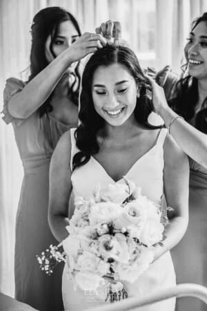 Sydney Wedding - bridesmaids help the bride attach her wedding veil