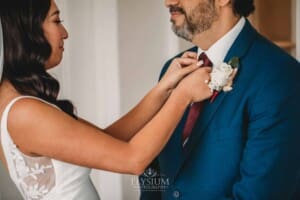 Sydney Wedding - a bride straightens her fathers tie before the ceremony