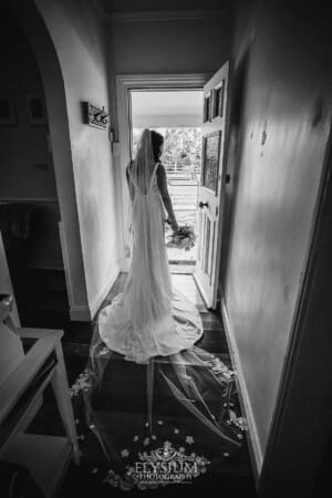 Sydney Wedding - a bride stands in a doorway before leaving to get married