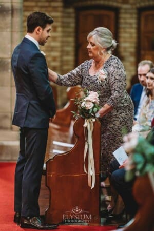 Sydney Wedding - a groom's mother adjusts his tie before the ceremony