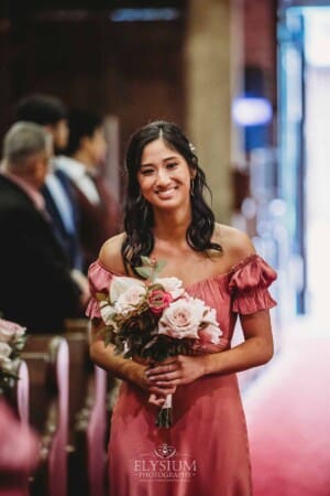 Sydney Wedding - a bridesmaid walks down the aisle at the ceremony
