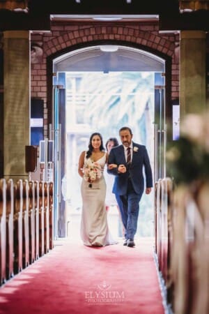 Sydney Wedding - a bride and her father walk down the aisle to the ceremony