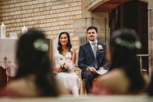 Sydney Wedding - a bride and groom sit together at their church ceremony