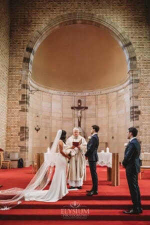 Sydney Wedding - a bride and groom stand together at their church ceremony