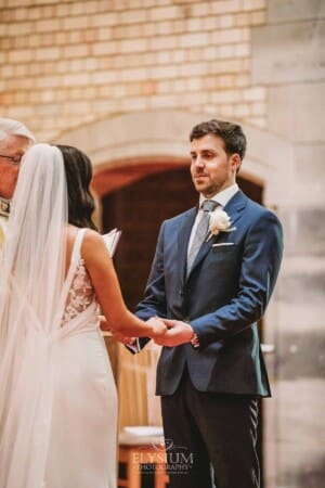Sydney Wedding - a bride and groom hold hands during the ceremony