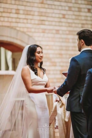 Sydney Wedding - a bride and groom hold hands during the ceremony