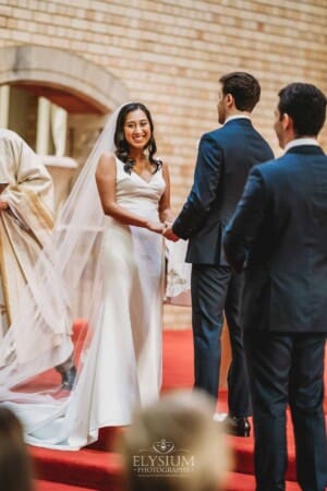 Sydney Wedding - a bride and groom hold hands during the ceremony