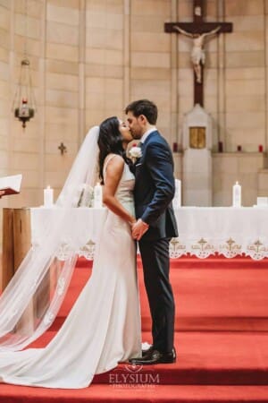 Sydney Wedding - a bride and groom share their first kiss during the ceremony