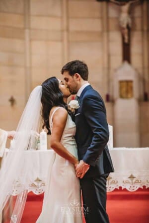 Sydney Wedding - a bride and groom share their first kiss during the ceremony