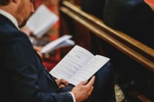 Sydney Wedding - a guest reads the program during the ceremony