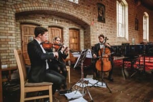 Sydney Wedding - a string trio play music for guests at the ceremony