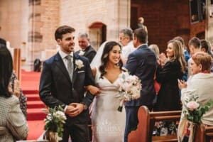 Sydney Wedding - a bride and groom walk down the aisle after the ceremony