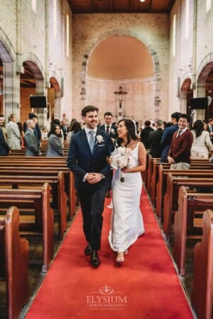 Sydney Wedding - Newlyweds walk back down the aisle after the ceremony