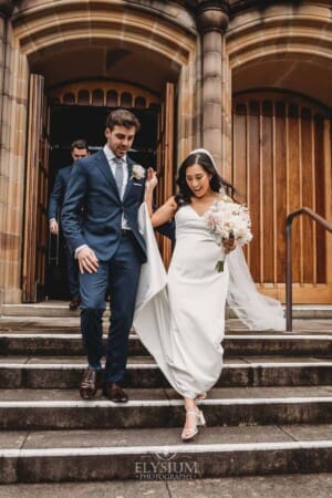 Sydney Wedding - a bride and groom exit the church after the ceremony