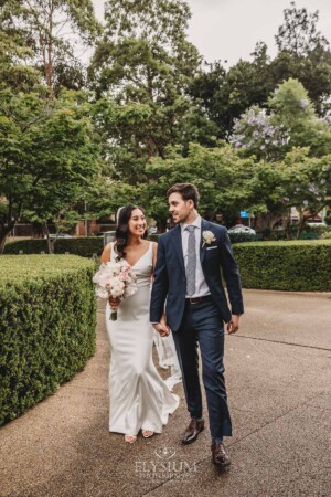 Sydney Wedding - newlyweds walk through the church gardens after the ceremony
