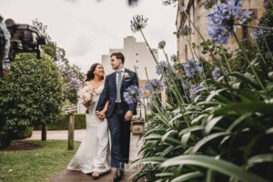 Sydney Wedding - newlyweds walk through the church gardens after the ceremony