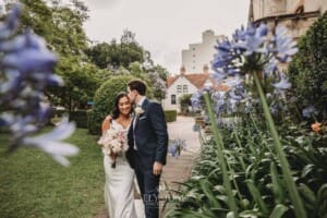 Sydney Wedding - newlyweds walk through the church gardens after the ceremony