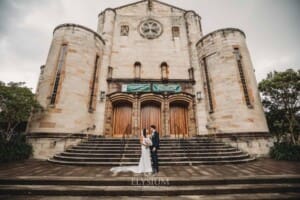 Sydney Wedding - bride and groom stand on the church steps after the ceremony