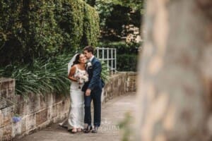 Sydney Wedding - bride and groom walk along the footpath after the ceremony