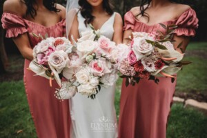 Sydney Wedding - a bride and her bridesmaid with their bouquets at Springfield House