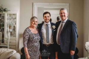 Sydney Wedding - a groom hugs his parents before leaving for the ceremony