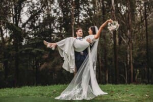 Sydney Wedding - a groom picks up his bride and spins her about at Springfield House