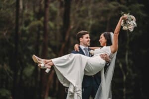 Sydney Wedding - a groom picks up his bride and spins her about at Springfield House