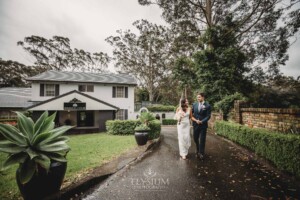 Sydney Wedding - bride and groom walk hand in hand along the driveway at Springfield House