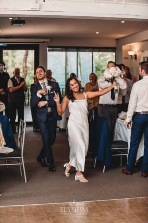 Sydney Wedding - bride and groom walk into their reception venue at Springfield House