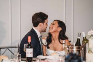 Sydney Wedding - newlyweds sit at the bridal table during their reception at Springfield House