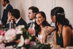 Sydney Wedding - newlyweds sit at the bridal table during their reception at Springfield House