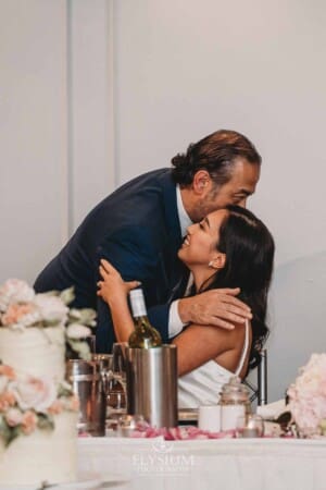 Sydney Wedding - bride's father hugs her during the reception at Springfield House