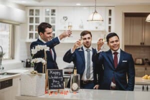 Sydney Wedding - a groom and his groomsmen toast champagne