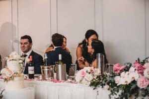 Sydney Wedding - bride hugs her sisters after their speech during the reception