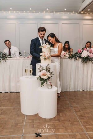 Sydney Wedding - the bride and groom cut their cake at the reception at Springfield House