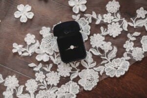 Sydney Wedding - a brides engagement ring in a black box sits on her veil