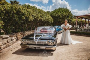 A bride arrives at her Camden wedding venue in a black car