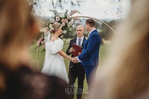 A couple exchange vows during their wedding ceremony in Camden