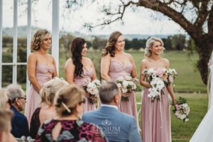 Bridal party stand at the front of the wedding ceremony