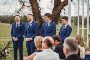 Bridal party stand at the front of the wedding ceremony