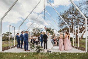 The peppercorn chapel at Burnham Grove hosts a wedding on a sunny day