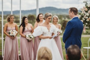 A couple exchange vows during their wedding ceremony at Burnham Grove