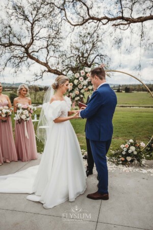 A couple exchange rings during their wedding ceremony at Camden