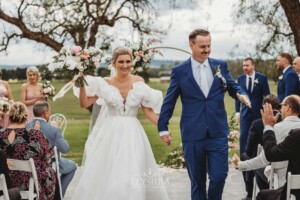 A couple walk the aisle after their Camden wedding ceremony