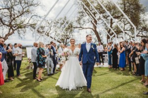 A couple walk up the aisle after their Camden wedding ceremony